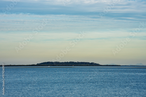 View south from Coochiemudlo Island across the bay toward Garden Island, on a calm winter day. Queensland, Australia 