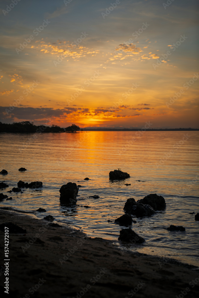 custom made wallpaper toronto digitalRocks in the foreground of a sunset view from Morwong Beach, Coochiemudlo Island, Queensland, Australia