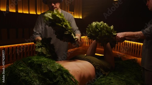 Bath Attendants With Oak Brooms Massaging Body Of Male Person In Sauna, Body Treatments