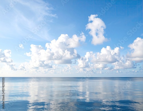 Calm, cloud-filled sky over a placid sea