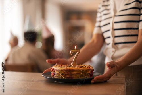 Birthday Celebration Featuring Cake With Number Seven Candle