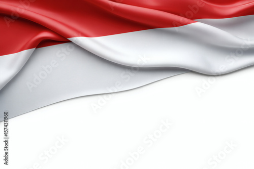 Indonesian flag elegantly draped, showcasing patriotic colors in a smooth, flowing fabric on a clean white background perfect for design.