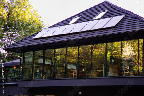 Modern Building with Solar Panels and Panoramic Windows