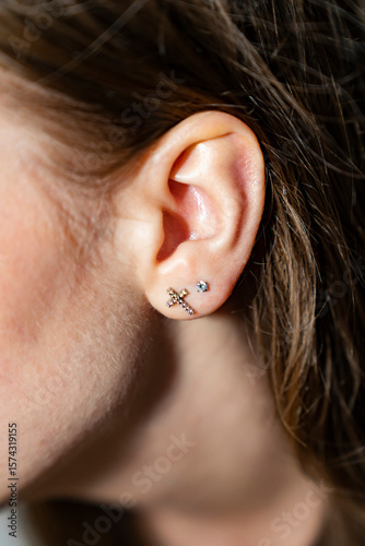The auricle of a girl with long hair. portrait of a young woman