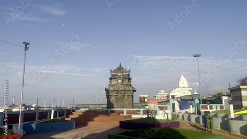 Video showing ancient mandapa structure surrounded by peaceful park.