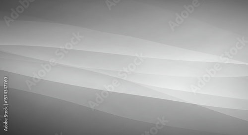 Abstract grayscale image of flowing, translucent fabric.