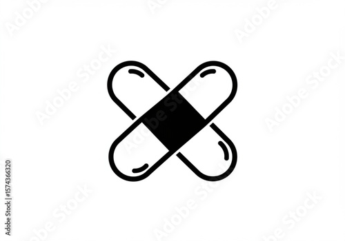 Simple black icon of two crossed medical pills on a white background