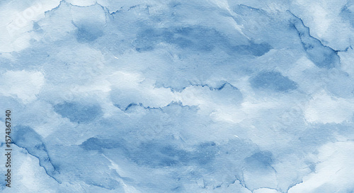 Soft, calming light blue watercolor wash with diffused textures evoking gentle abstract formations.