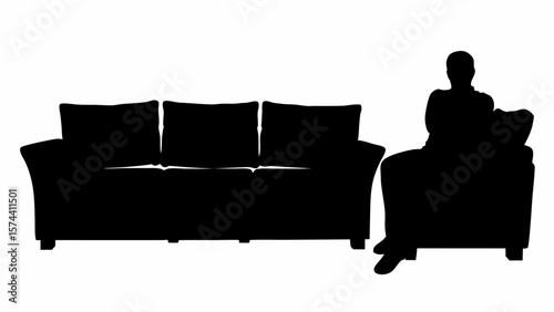 Silhouette of a person sitting in an armchair next to a three seater sofa against a white background