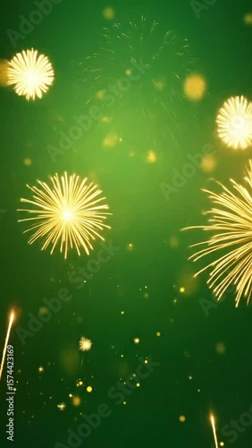 Golden fireworks against dark green background