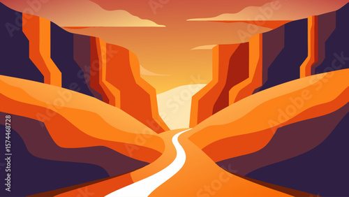 A mountain range with a road running through it. The sky is orange and the sun is setting