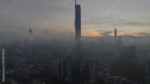 Wallpaper Mural Establishing aerial cinematic b-roll shot of sunrise at Kuala Lumpur city skyline with highest building in Asia Torontodigital.ca