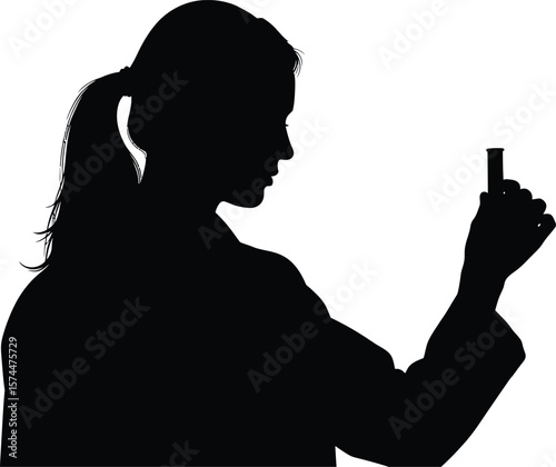 A silhouette of a female scientist holding a test tube, representing scientific research and discovery