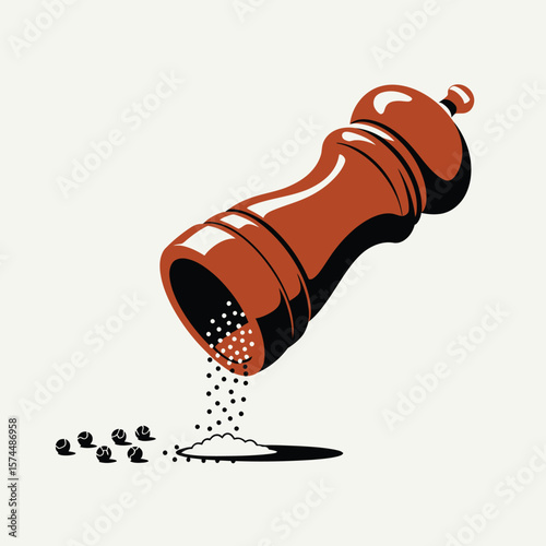 Brown pepper mill grinding black peppercorns onto a light background