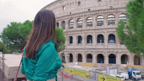 Woman Admiring the Colosseum in Rome
