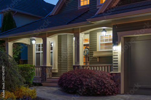 Entrance of luxury house with nice spring blossom landscape at night in Vancouver, Canada, North America. May 2025.