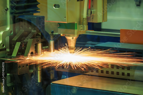 Close up scene the fiber laser cutting machine cut the metal plate control by CNC program.