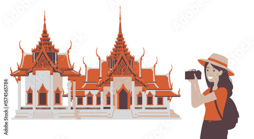 Smiling Tourist Woman Photographing a Traditional Thai Temple with Ornate Roofs.