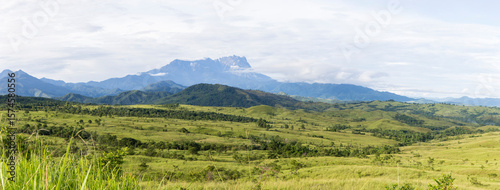 Wide Panorama of Mount Kinabalu Rising Above the Lush Rolling Hills of Sabah, Borneo, Malaysia