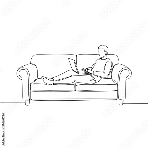 Man working on laptop while sitting on sofa in minimalist style  