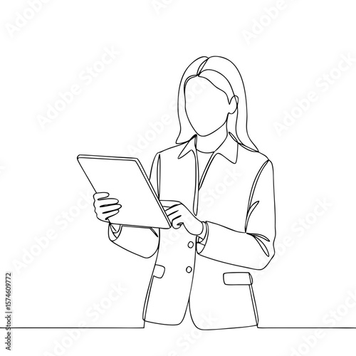 Businesswoman using tablet while standing in formal attire  
