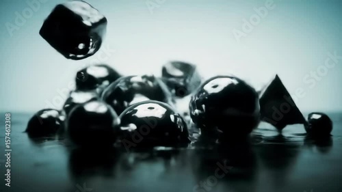 Liquid Metal Geometric Shapes Rising from Reflective Surface