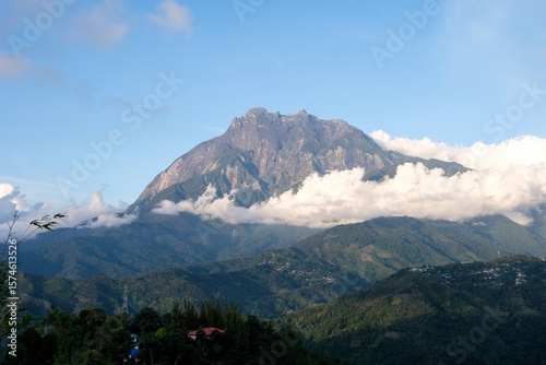 Majestic Mount Kinabalu in Sabah, Malaysia, Rising Above the Clouds and Lush Green Hills