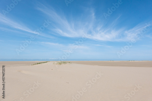 Cirrus clouds above beach, wispy, feathery clouds made of long strands of ice crystals