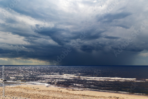 A large thundercloud looms on the horizon before a storm over the Baltic Sea in Jurmala, Latvia