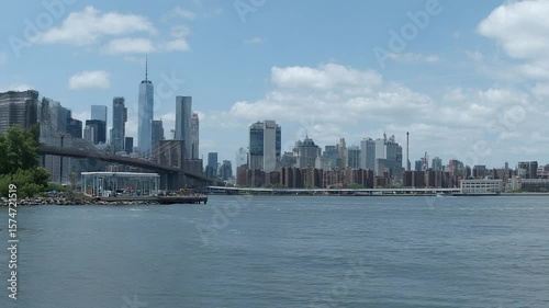 Stunning view of the New York City skyline with the Brooklyn Bridge in the foreground on a sunny day