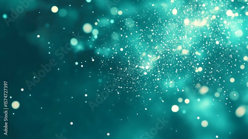 Teal background with sparkling light effects.