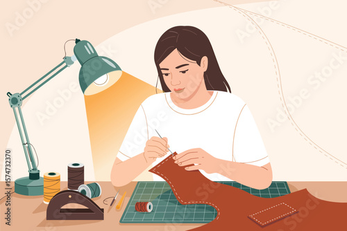 Focused Woman Hand Stitching Leather Goods at Home