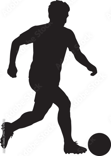 Silhouette of a soccer player kicking a ball football