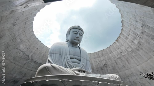 Serene Buddha Statue Surrounded by Modern Architecture