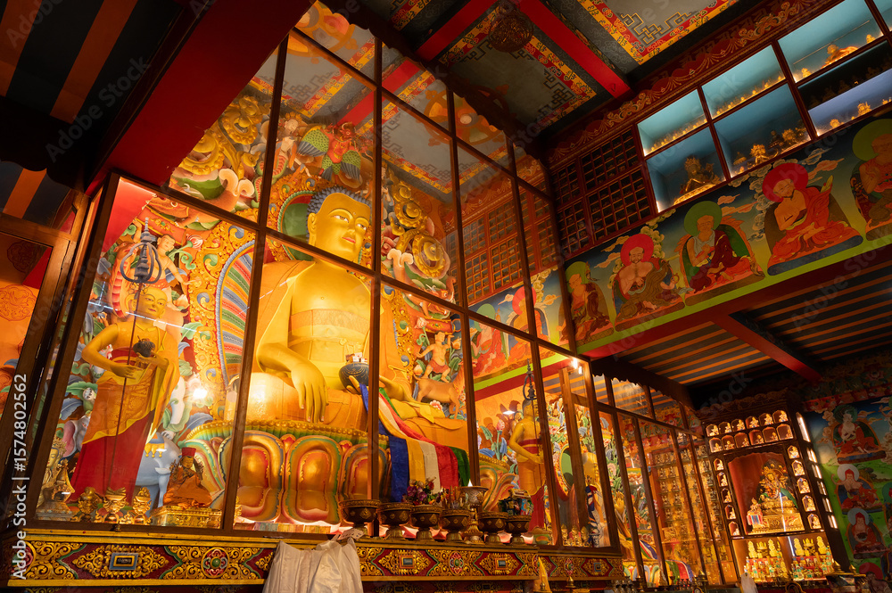 Obraz premium Darjeeling ,West Bengal, India - 20.08.2023 : Beautiful view of interior of Ghum Monastery. Image taken with permission. Peaceful, calm and religious respected environment inside Buddist Monastery.