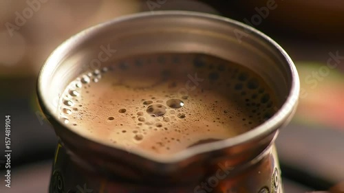Brewing Turkish coffee, close-up, blurry background