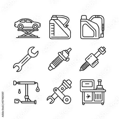 A variety of automotive repair tools and car maintenance equipment, including wrenches and spark plugs