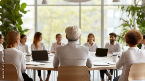 A business team in a meeting, discussing plans and ideas