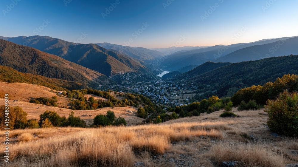 Golden light sets over a picturesque autumn landscape, revealing vibrant trees and tranquil hills in a peaceful mountain valley Golden light sets over a picturesque autumn landscape, revealing vibrant trees and tranquil hills in a peaceful mountain valley