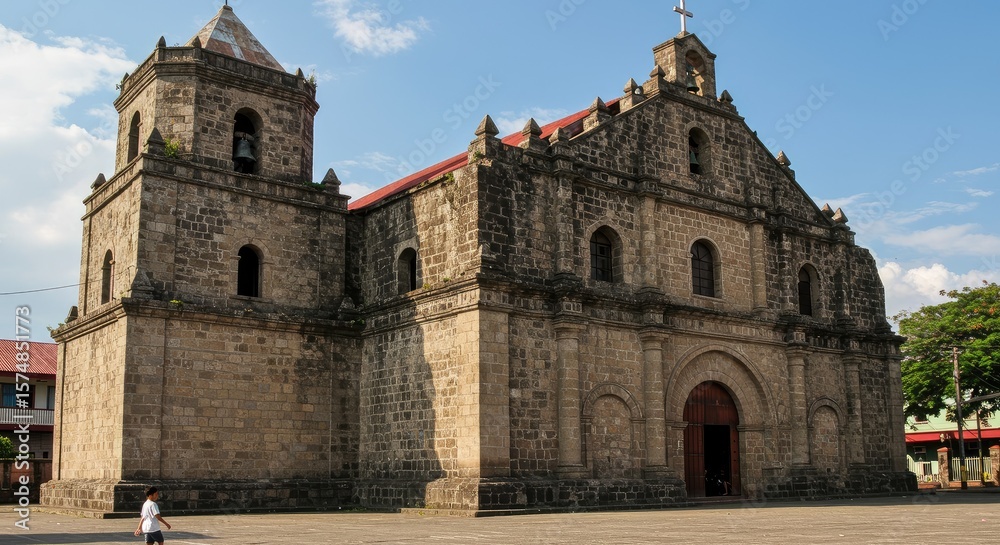 A historic stone church facade under a partly cloudy sky. Exterior view of a large, aged church building A historic stone church facade under a partly cloudy sky. Exterior view of a large, aged church building