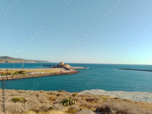 Fototapeta Naklejka Na Ścianę i Meble -  view of the coast of Bosa Marina with an old tower used to guard the sea