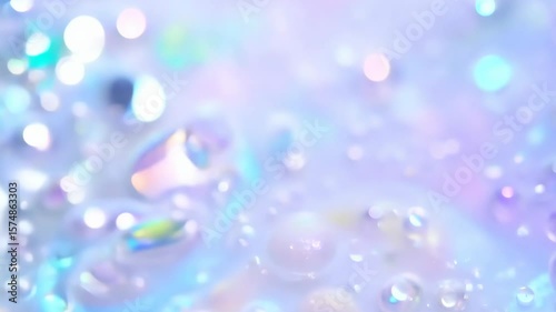 Dynamic drops of holographic glitter in pastel violet oil or ink diffusing through water, creating an abstract aquatic swirls