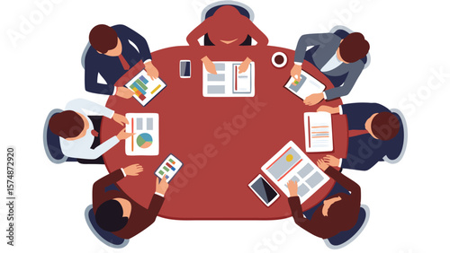 Overhead view of a business meeting with seven people around a round table with documents and devices