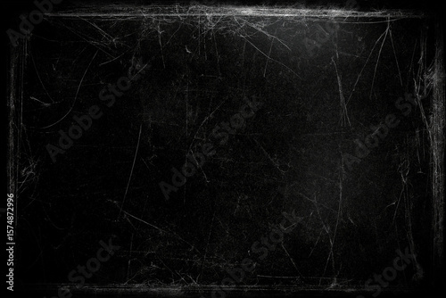 A very dark solid black background with scratches to go behind movie credits for a horror movie. mostly solid black