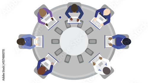 Aerial view of diverse professionals working on laptops around a circular conference table in a meeting room