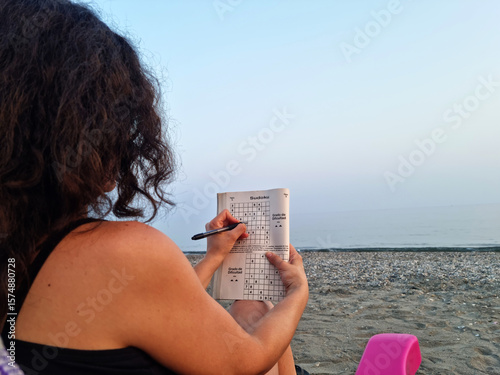 A person doing hobbies on the beach