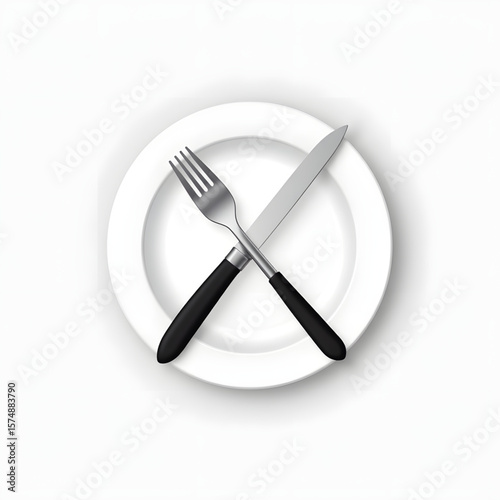 Cutlery on white plate with fork and knife crossed  