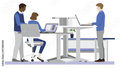 Three people in an office setting working on laptops at desks with one person standing up right