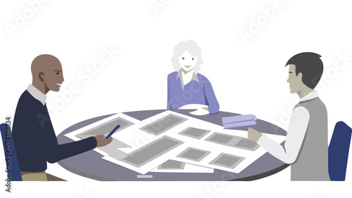 Three people sitting around a table covered with documents in a meeting or collaborative workspace