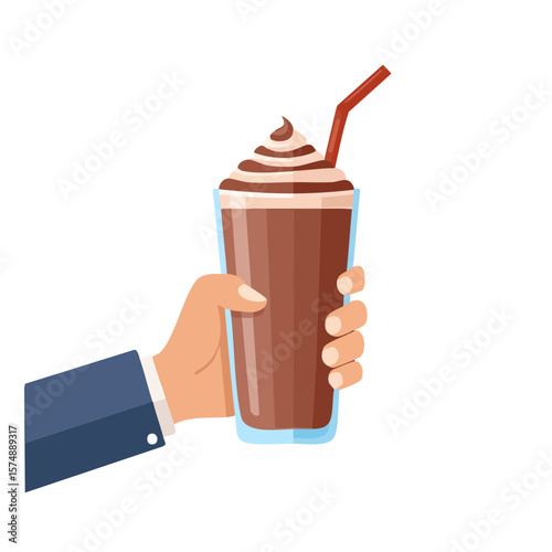 A hand holding a refreshing chocolate milkshake in a tall glass with a straw. The milkshake is topped with whipped cream